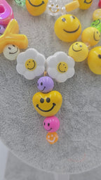 HAPPY, the ultimate festival necklace.