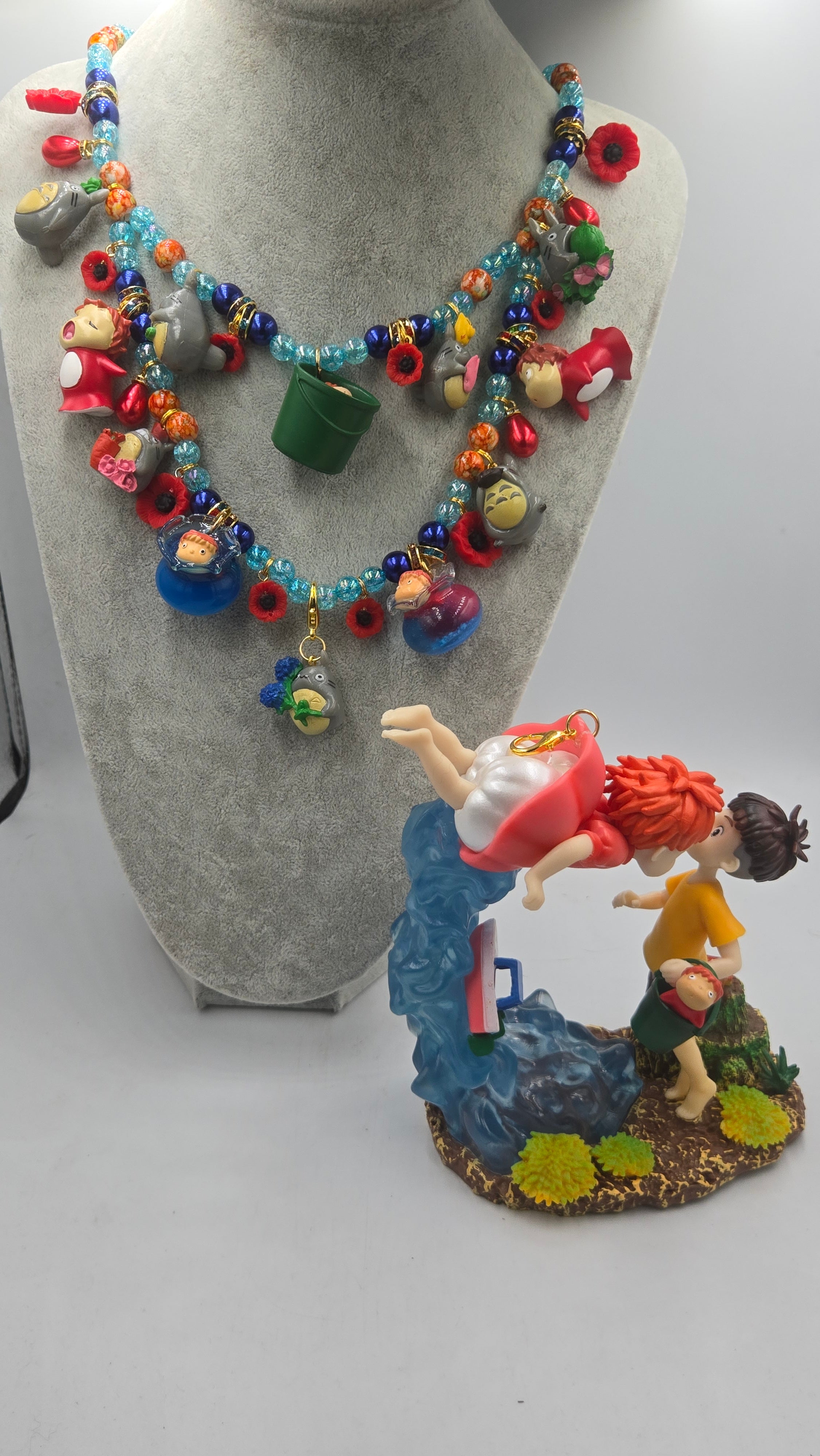 Sosuke and Ponyo on a cliff by the sea