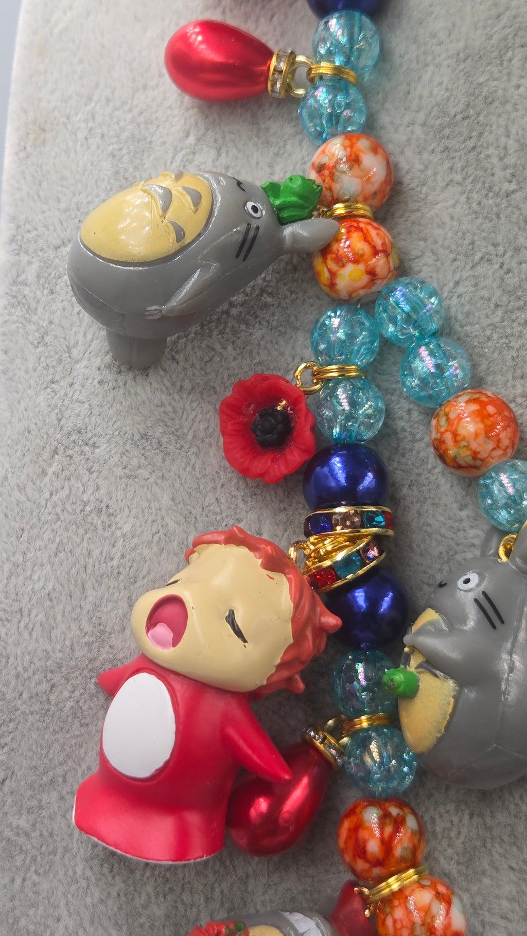 Sosuke and Ponyo on a cliff by the sea