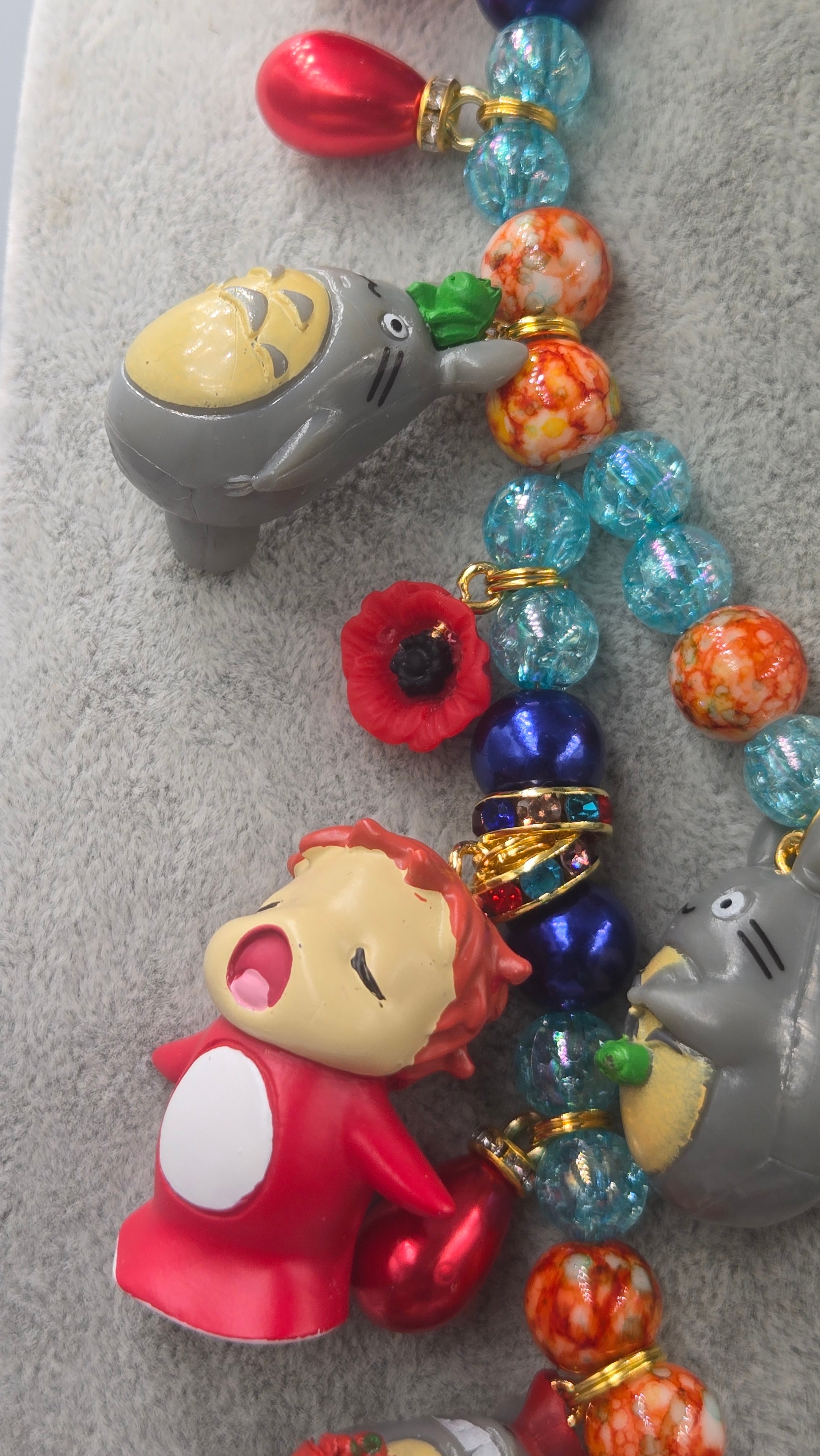 Sosuke and Ponyo on a cliff by the sea