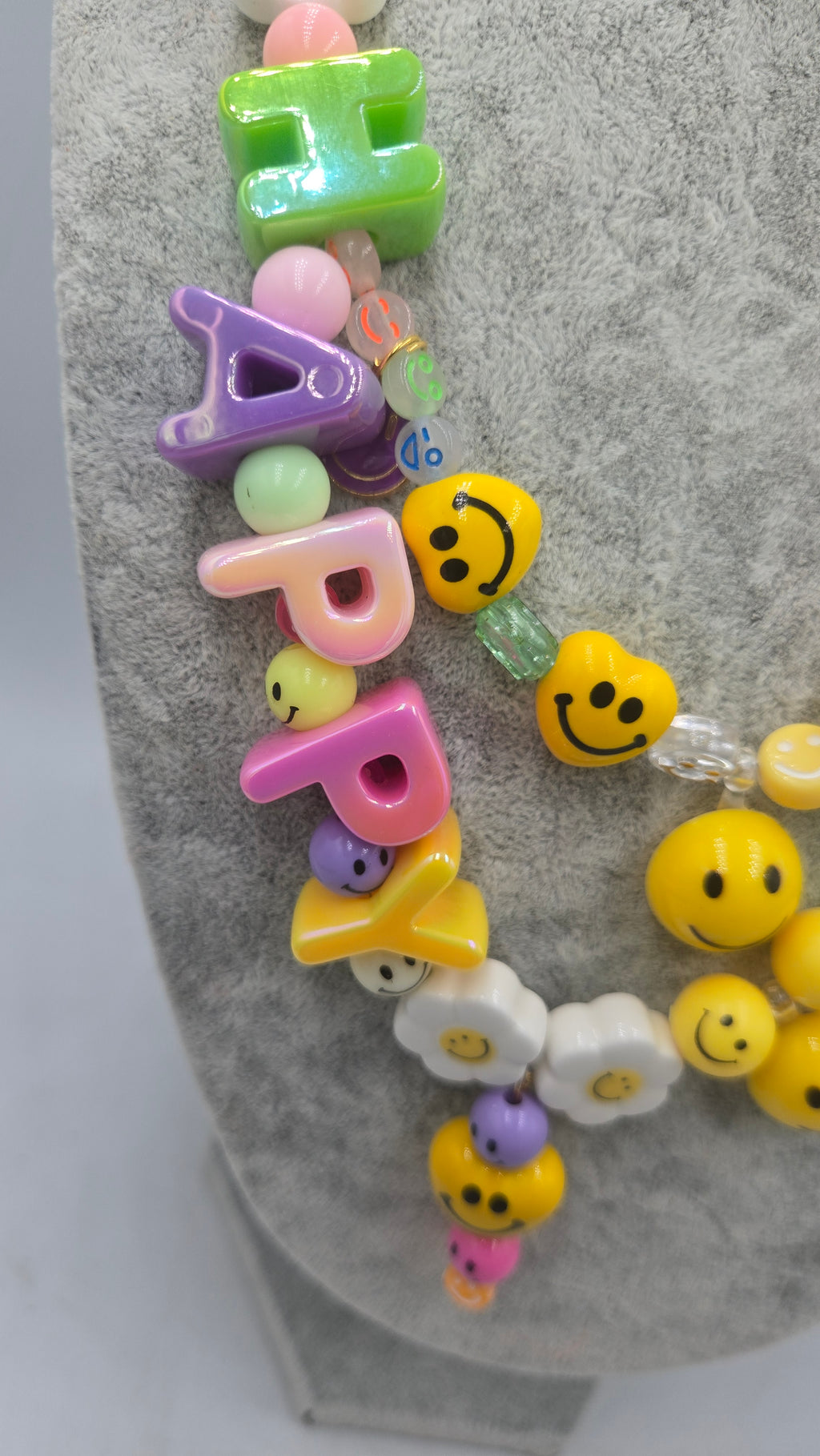 HAPPY, the ultimate festival necklace.