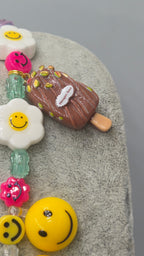 HAPPY, the ultimate festival necklace.